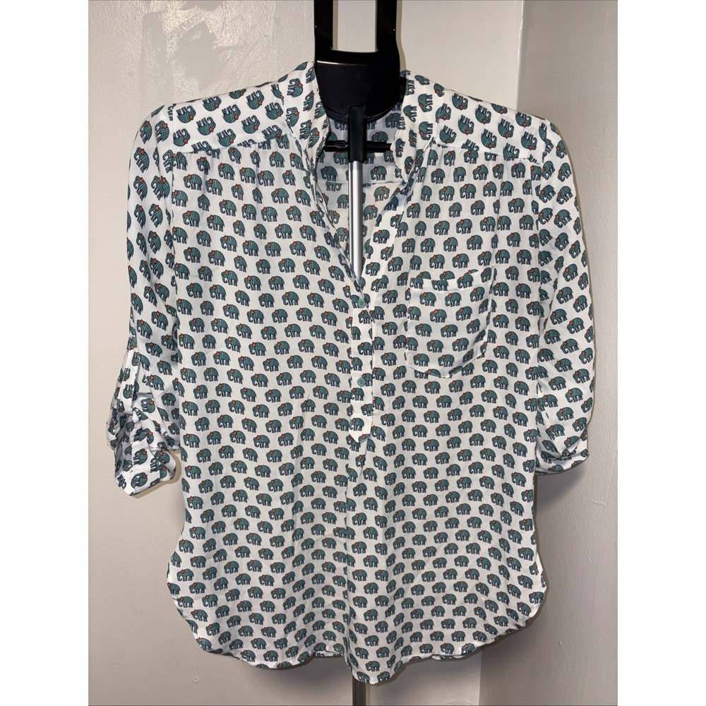 Cals blouse featuring an allover green elephant print on a rich White size Large